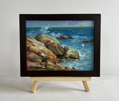 Framed oil painting of sailboats on sea horizon with crashing waves by Yuriy Suprunchuk
