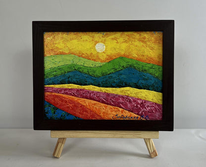 Oil painting of flower meadow silhouettes by V. Zadorozhnya in black frame