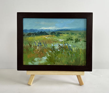 Oil painting On the summer flower meadows by Yuriy Suprunchuk on easel