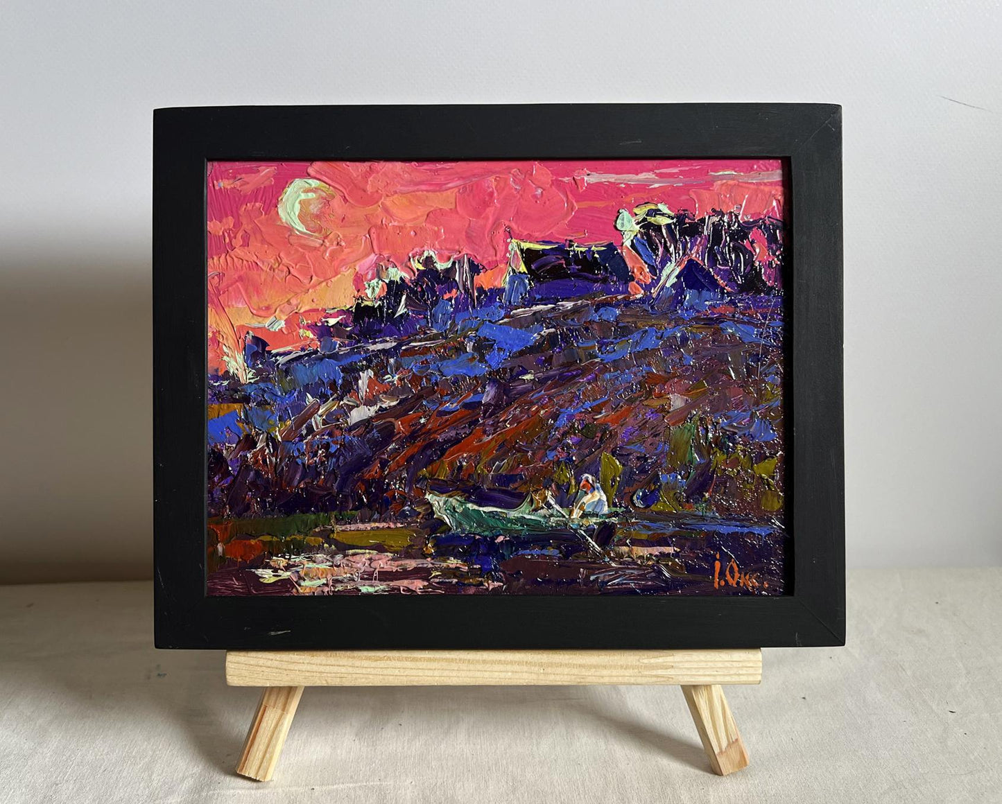 Oil painting Crimson Evening by the River by Oksana Ivanyuk in black frame