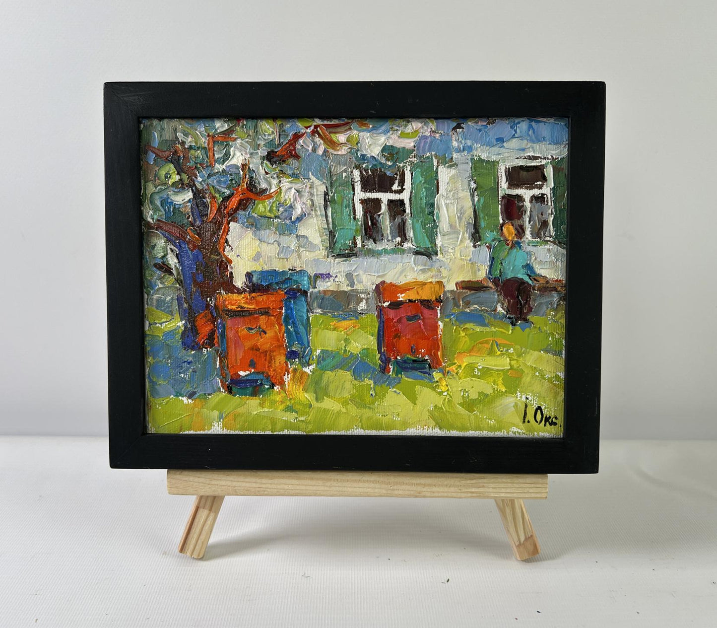 Oil painting Backyard moments by Oksana Ivanyuk with beehives in black frame
