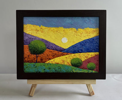 Oil painting of flaming mountain peaks by V. Zadorozhnya in black frame
