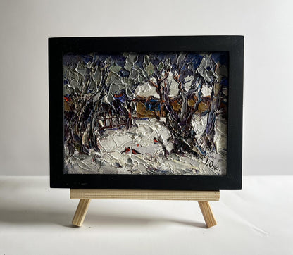 Oil painting Bullfinch in snowy yard by Oksana Ivanyuk in black frame