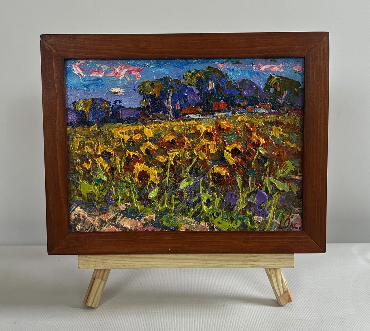 Vibrant oil painting of sunflower field in village by Oksana Ivanyuk in wooden frame