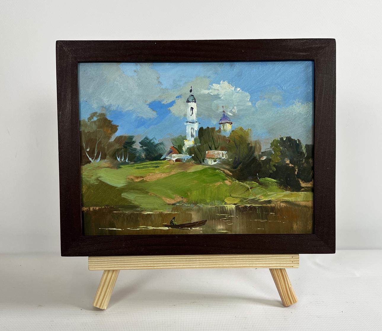 Oil painting of village church by Yuriy Suprunchuk in dark wooden frame