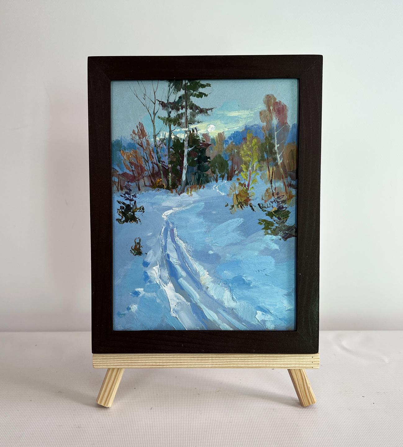 Oil painting Winter sunset in the forest by Yuriy Suprunchuk in dark frame on easel