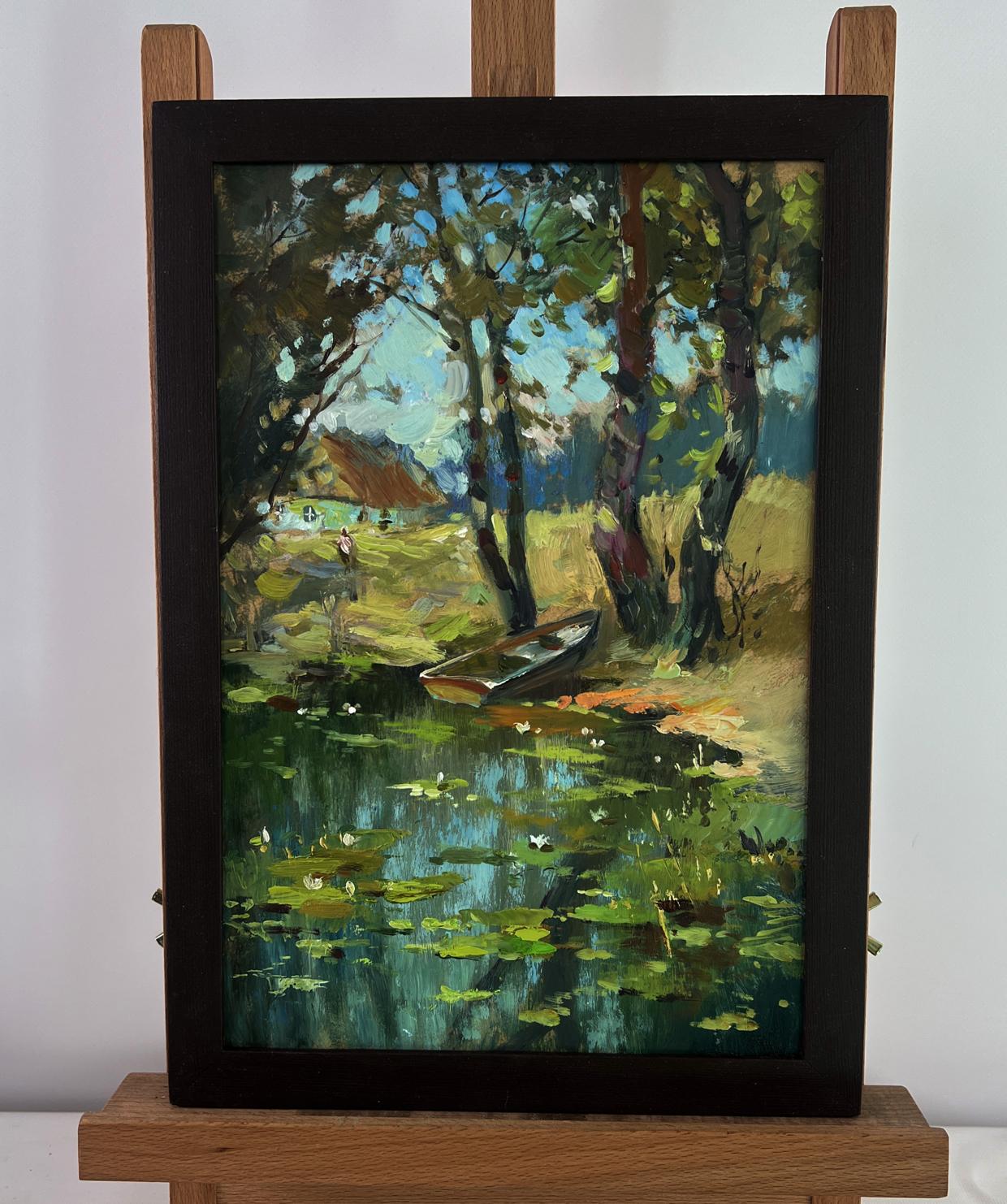 Framed oil painting of serene lakeside with lily pads, trees, and Yuriy Suprunchuks Fishermans boat