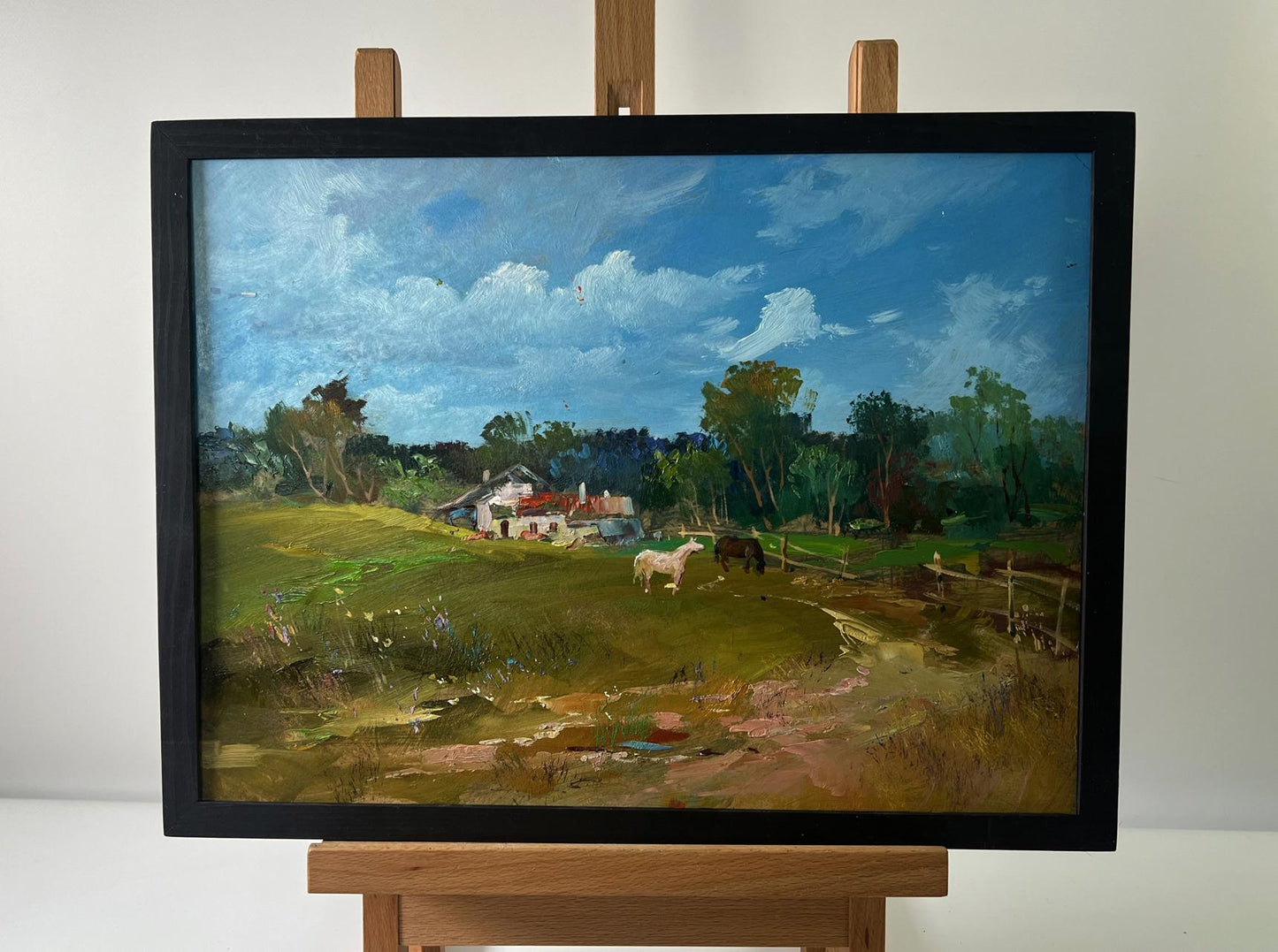 Framed oil painting of village landscape with cows by Yuriy Suprunchuk