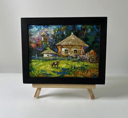 Oil painting Quiet village life by Oksana Ivanyuk in black frame