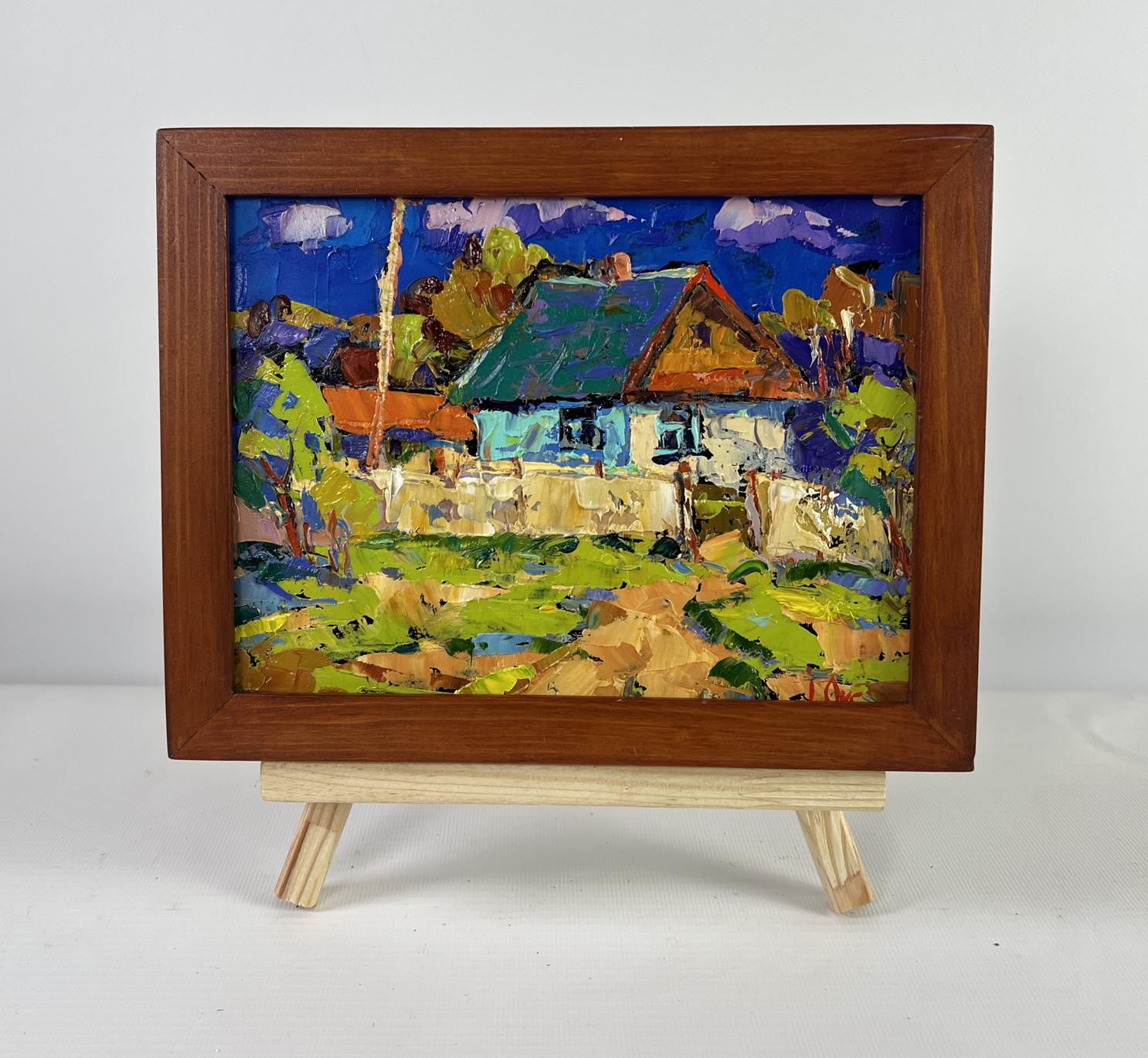Vibrant impressionist oil painting of Oksana Ivanyuk tree house with green roof, blue walls in rustic frame