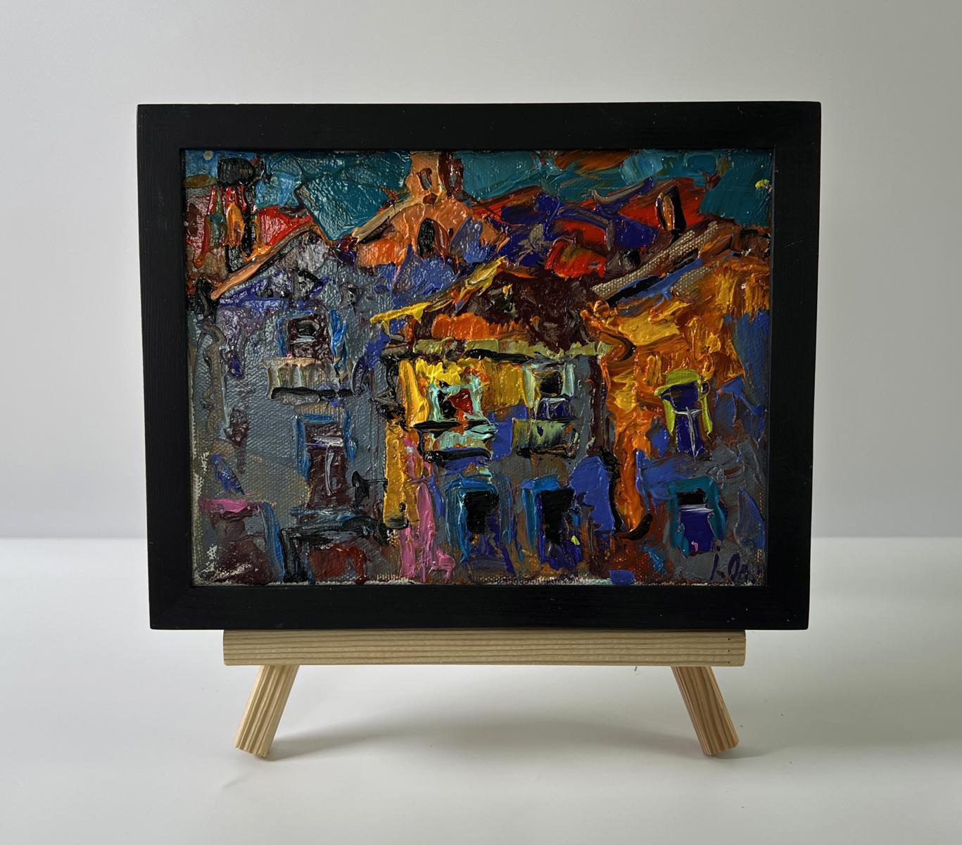 Vibrant oil painting of colorful night-lit city village by Oleksiy Ivanyuk in black frame