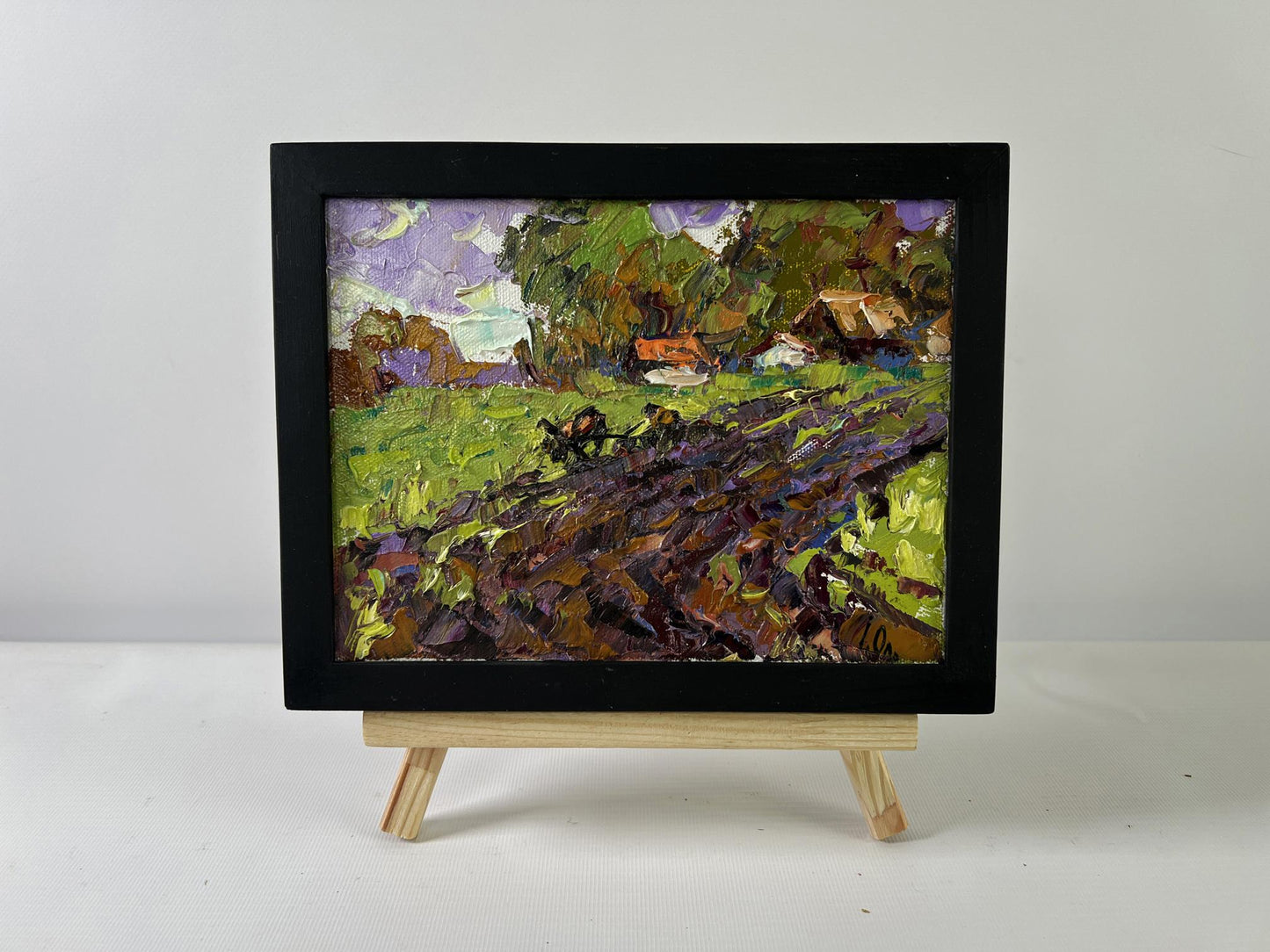 Oil painting Morning in the village by Oleksiy Ivanyuk, vibrant green field landscape