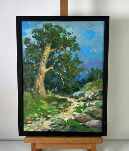 Oil painting of daytime road into forest by Yuriy Suprunchuk on easel