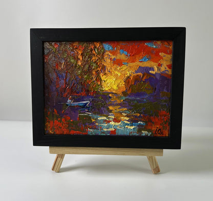 Oil painting Crimson sunset over the river by Oleksiy Ivanyuk in black frame