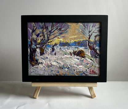 Black-framed impressionistic snowy winter evening landscape by Oleksiy Ivanyuk