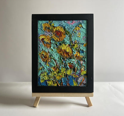 Oil painting of sunflowers in the field by Oksana Ivanyuk, vibrant yellow orange on teal in black frame