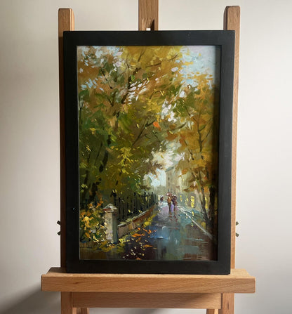 Oil painting Walking in the autumn city park by Yuriy Suprunchuk in black frame