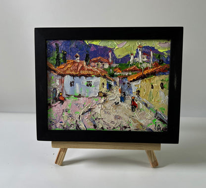 Vibrant textured oil painting of old residential town by Oleksiy Ivanyuk in black frame