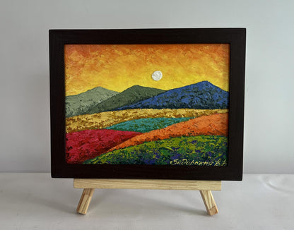 Oil painting by V. Zadorozhnya: sunset behind mountains in black frame