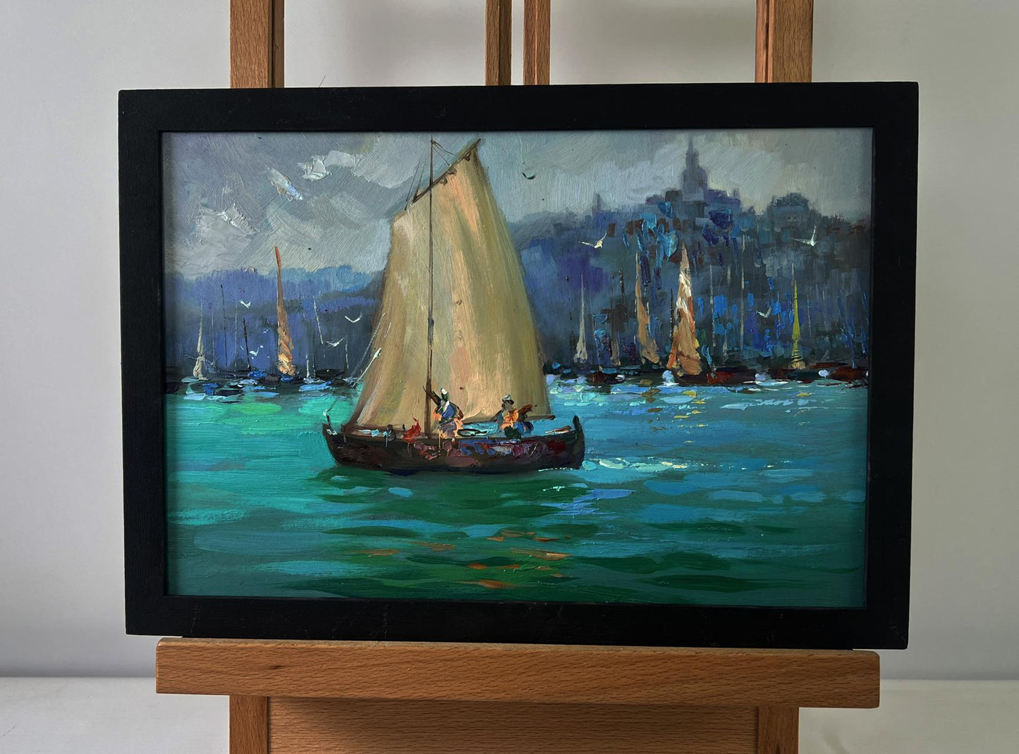 Oil painting of fishermen greeting dawn: sailboat with cream sails on turquoise sea by Yuriy Suprunchuk