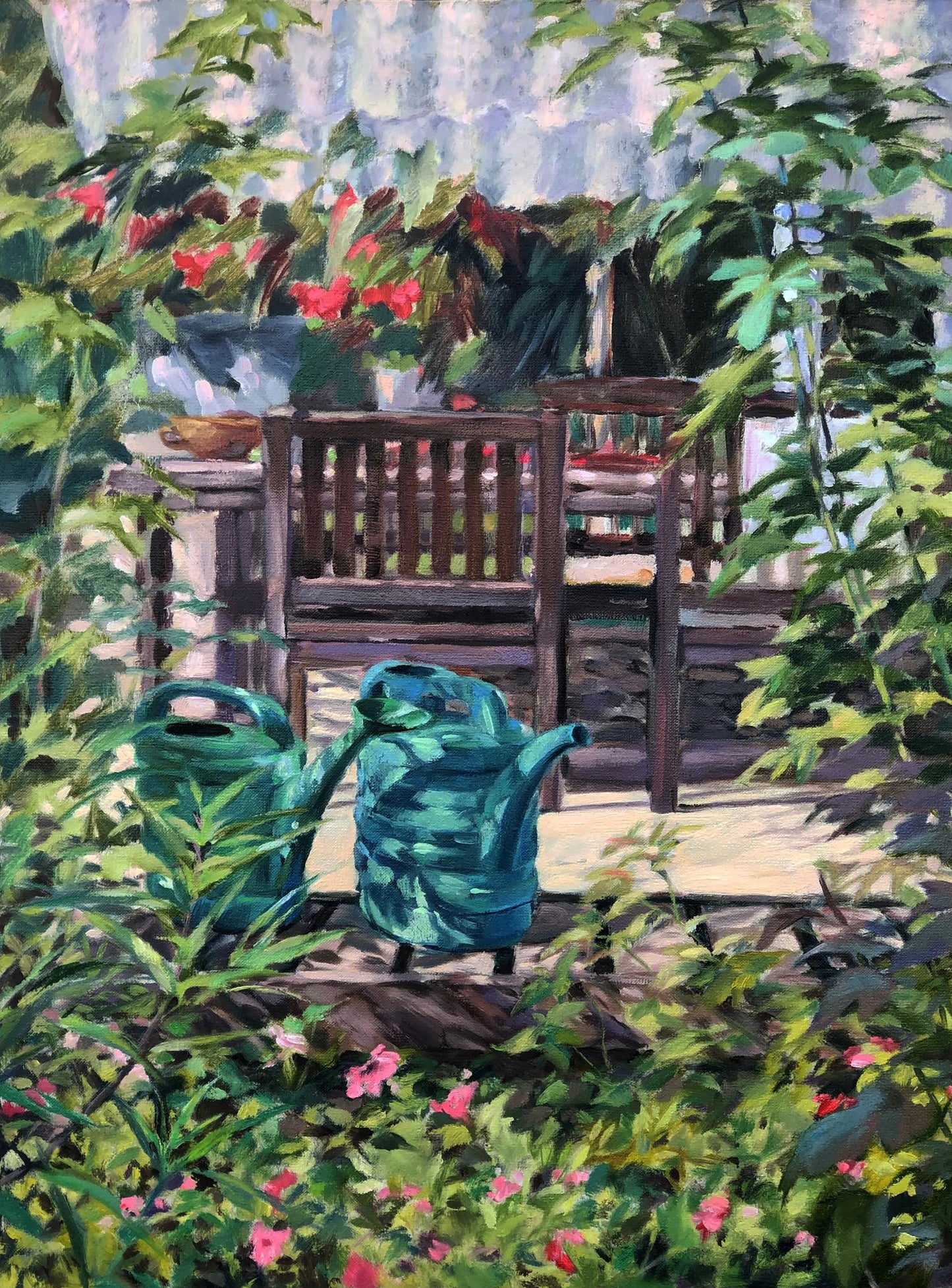 Two teal plastic watering cans sit nestled among lush green foliage in a garden scene.