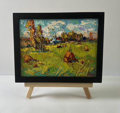 Oil painting Sunny day in the field by Oksana Ivanyuk in black frame