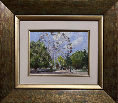 Oil painting of Ferris wheel by Yury Konovalov in ornate gold frame