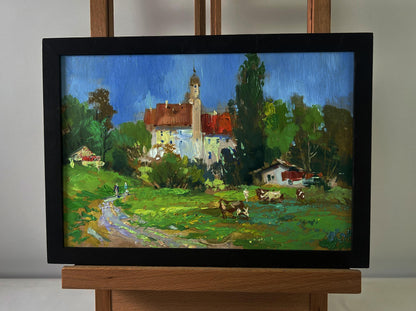 Framed oil painting by Yuriy Suprunchuk of castle over steppe with village scene