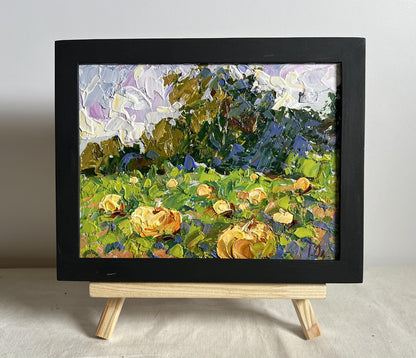Vibrant impressionist oil painting of yellow flowers by Oleksiy Ivanyuk on easel