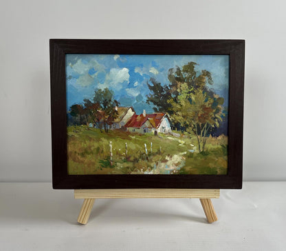 Oil painting Houses in the forest by Yuriy Suprunchuk in dark frame