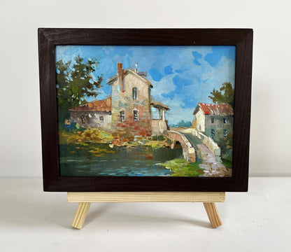 Rustic oil painting by Yuriy Suprunchuk of village bridge in wooden frame