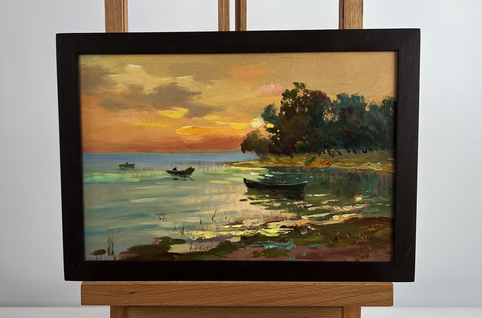 Oil painting of orange sunset over river by Yuriy Suprunchuk in black frame