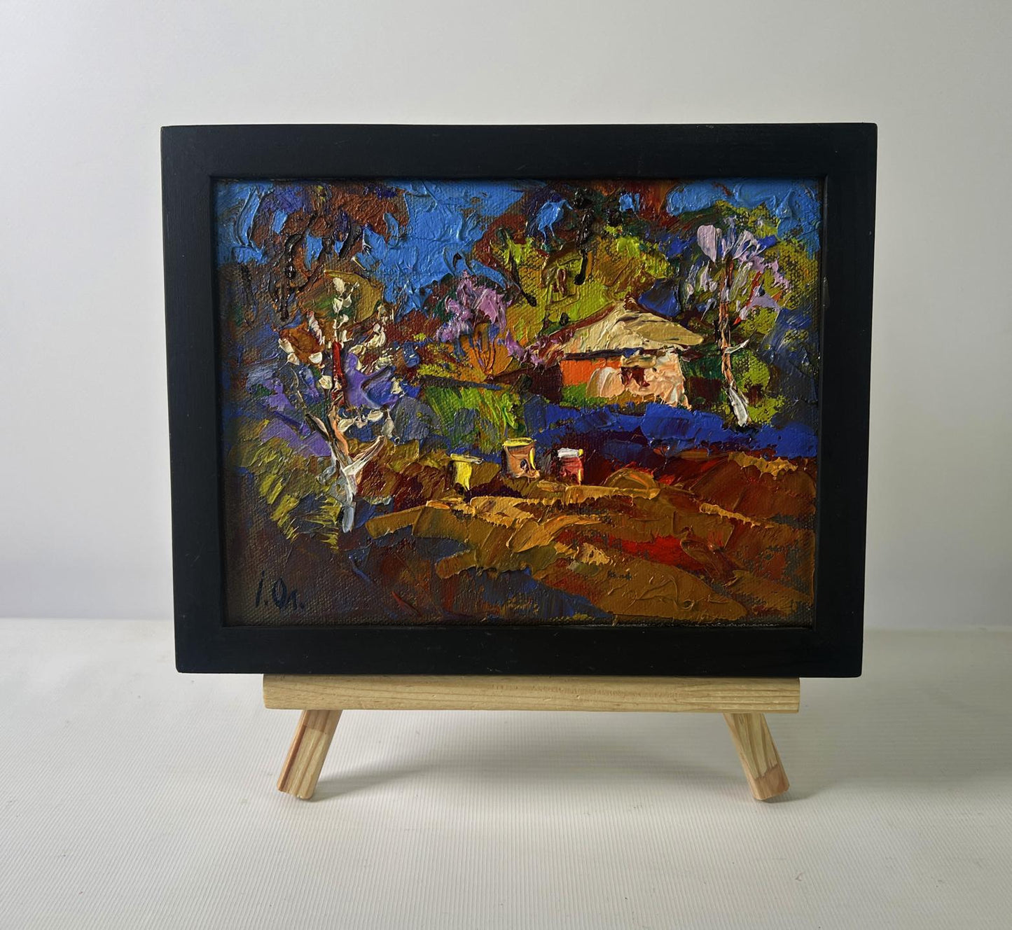 Oil painting Evening ray over spring fields by Oleksiy Ivanyuk in black frame