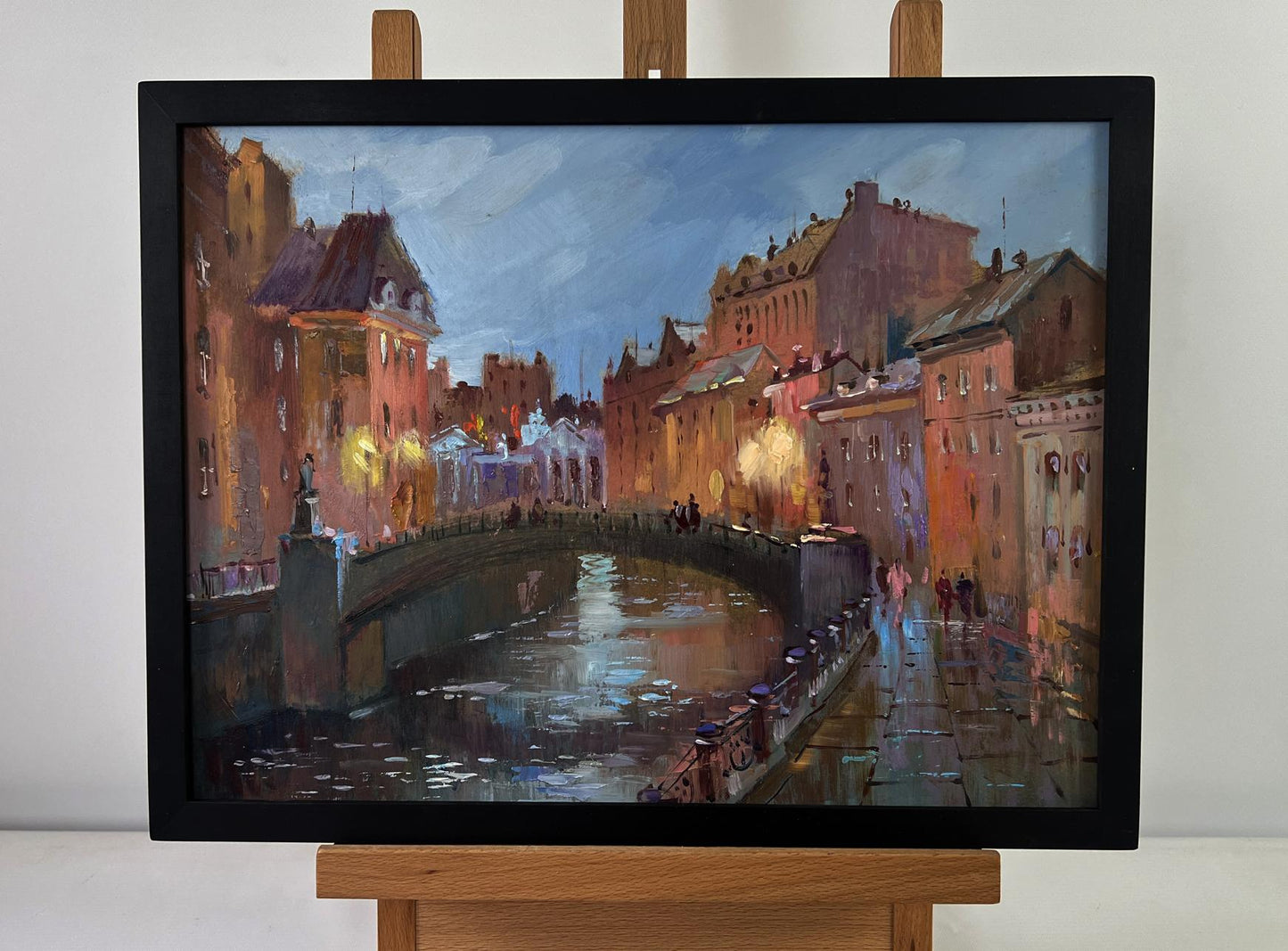 Framed oil painting of city streets at night by Yuriy Suprunchuk