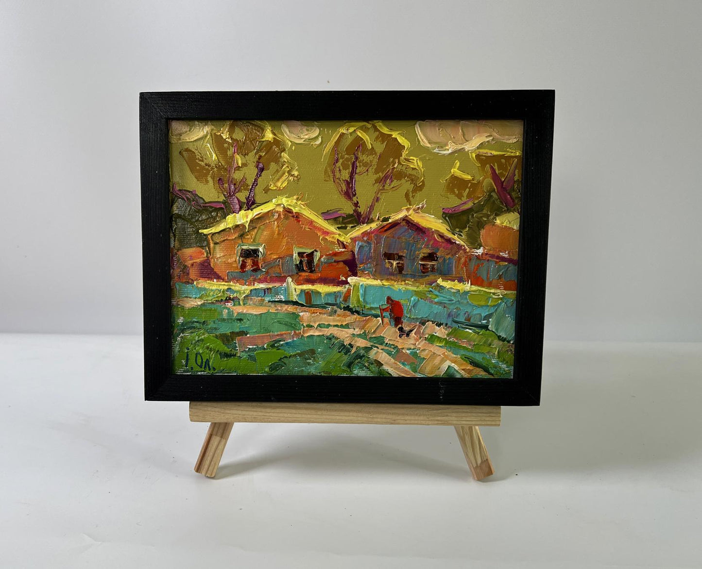 Oil painting A warm village evening by Oleksiy Ivanyuk in black frame