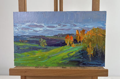 Vibrant impressionist oil painting by Boris Serdyuk: green hills, autumn trees, blue sky
