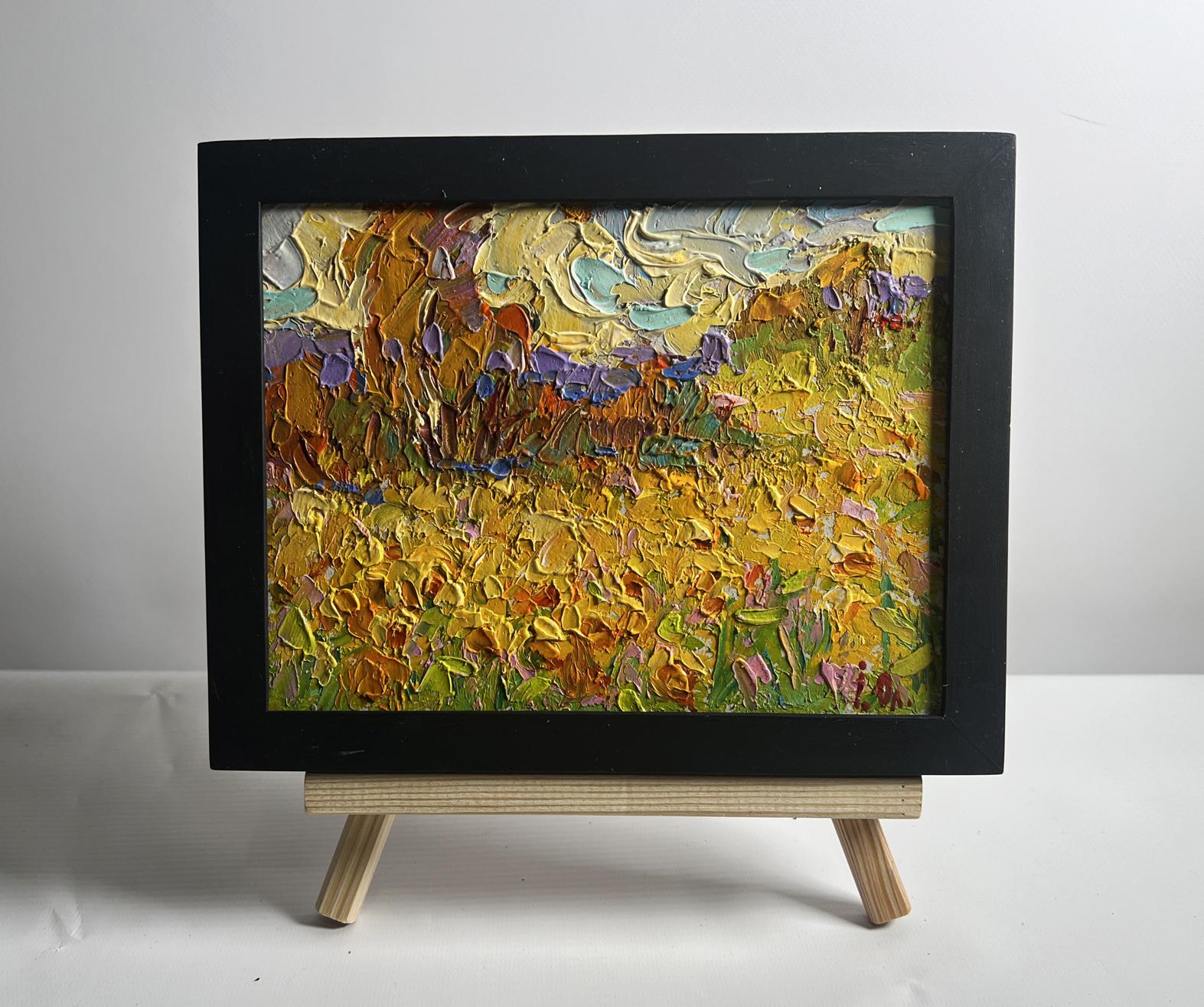 Oil painting of huge sunlit sunflower fields by Oleksiy Ivanyuk in black frame