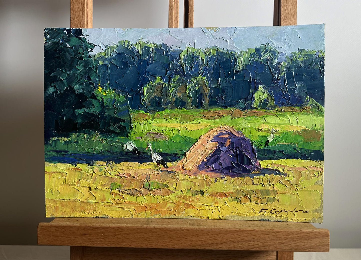 Vibrant impressionist oil painting of hay bale in sunlit field by Boris Serdyuk