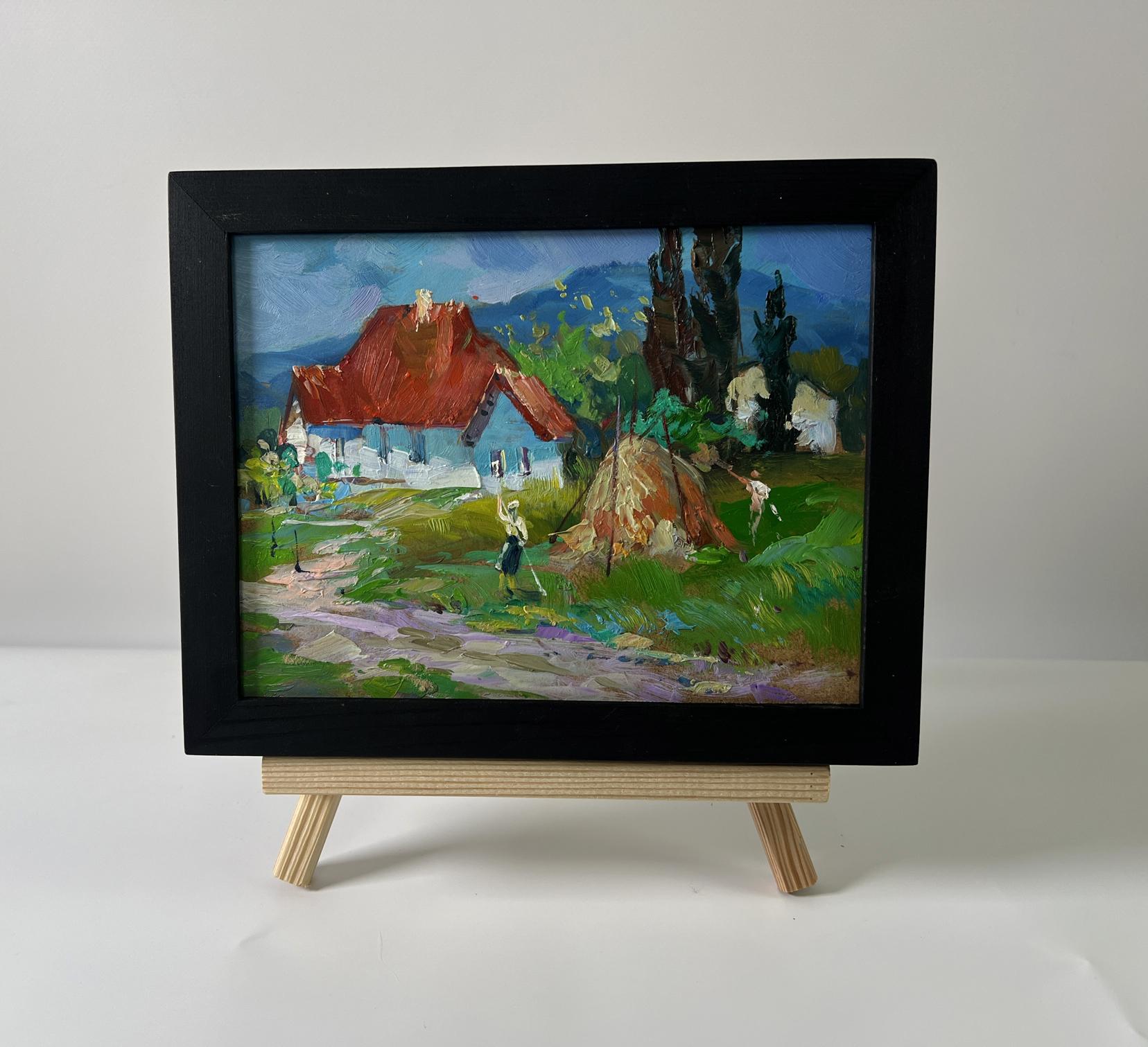 Oil painting of village near mountains by Yuriy Suprunchuk on wooden easel