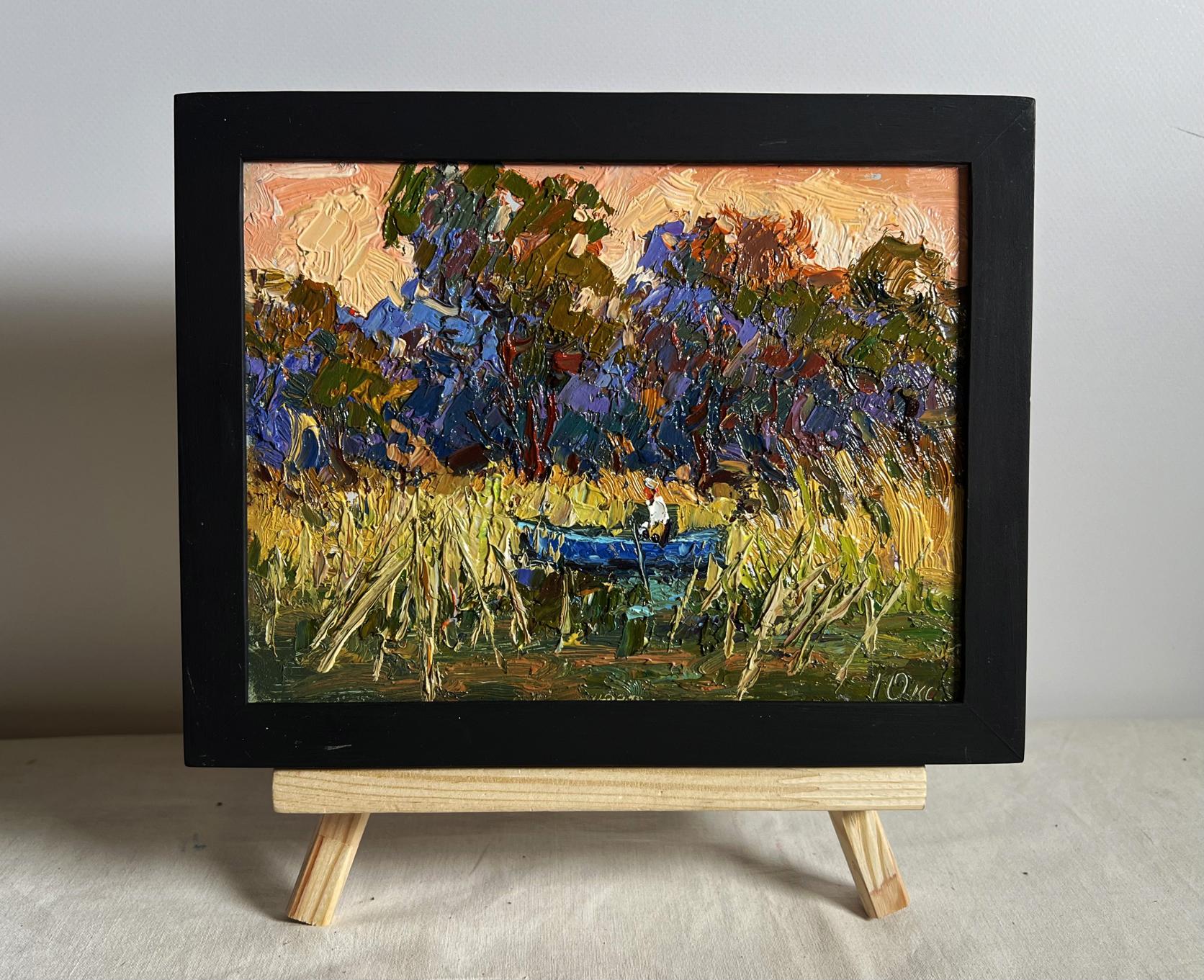 Oil painting of blue boat among golden reeds by Oksana Ivanyuk in black frame