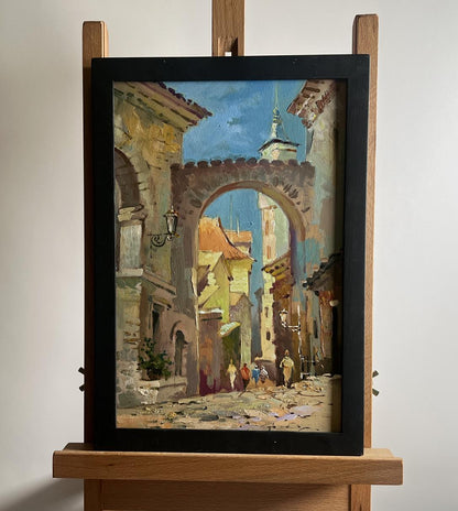 Framed oil painting of old sunlit European city street by Yuriy Suprunchuk