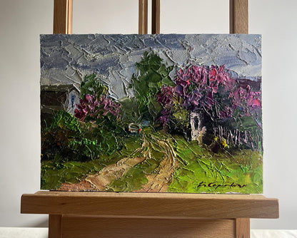 Oil painting Lilac growing in village by Boris Serdyuk on easel