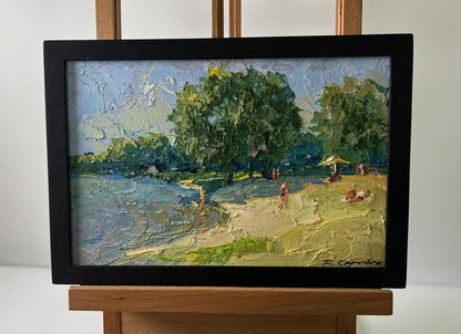 Framed oil painting by Boris Serdyuk of people relaxing on sunny river beach