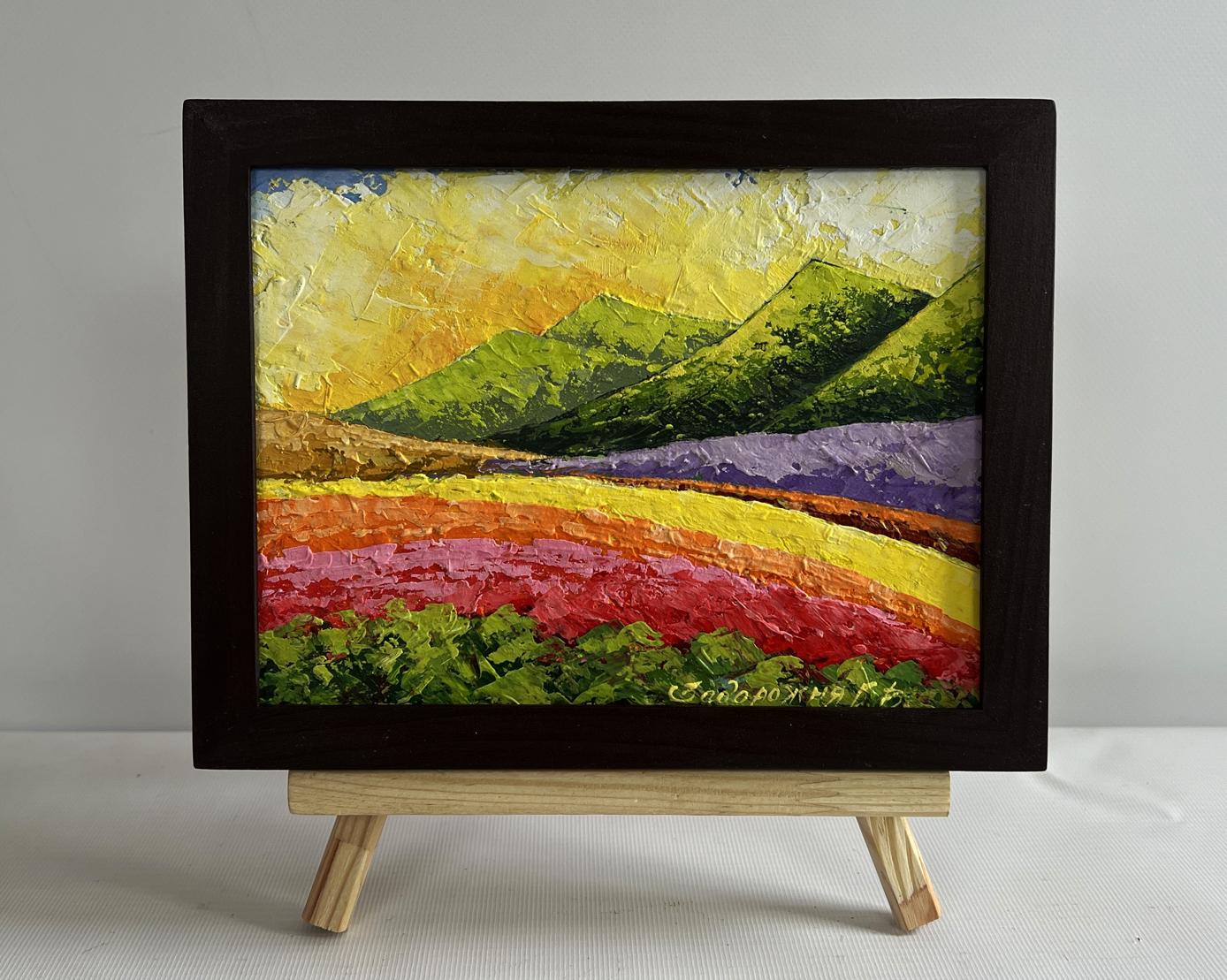 Oil painting of sunset behind mountains by V. Zadorozhnya in dark frame