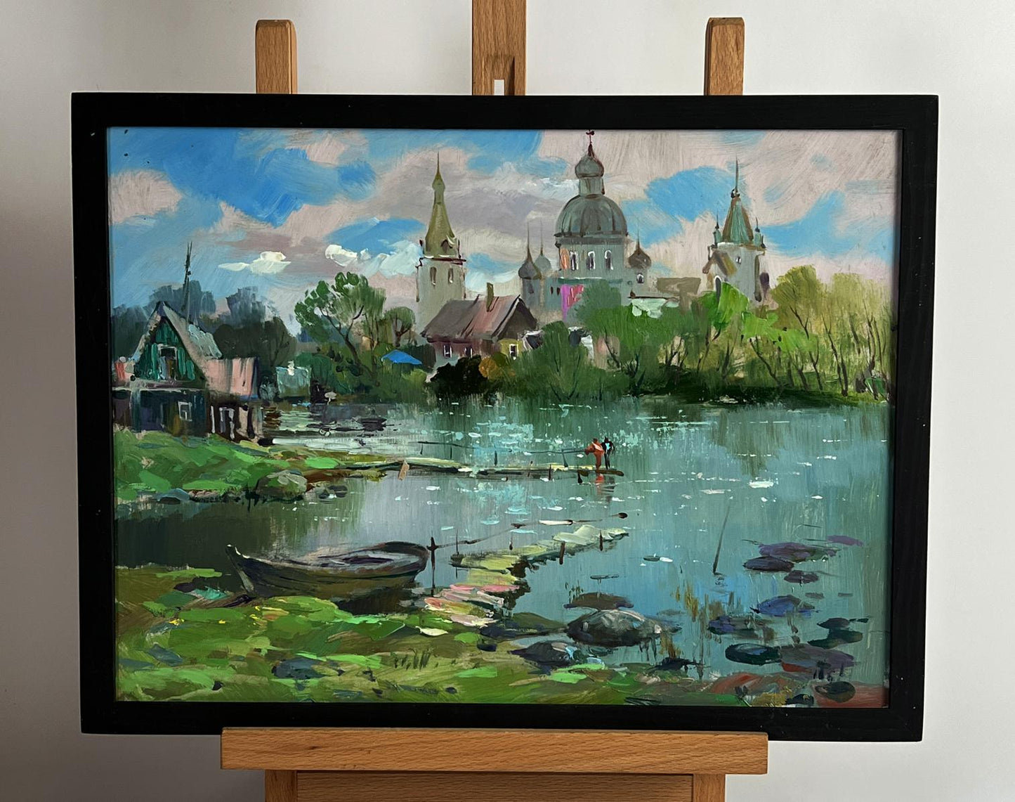 Framed oil painting of river near church by Yuriy Suprunchuk