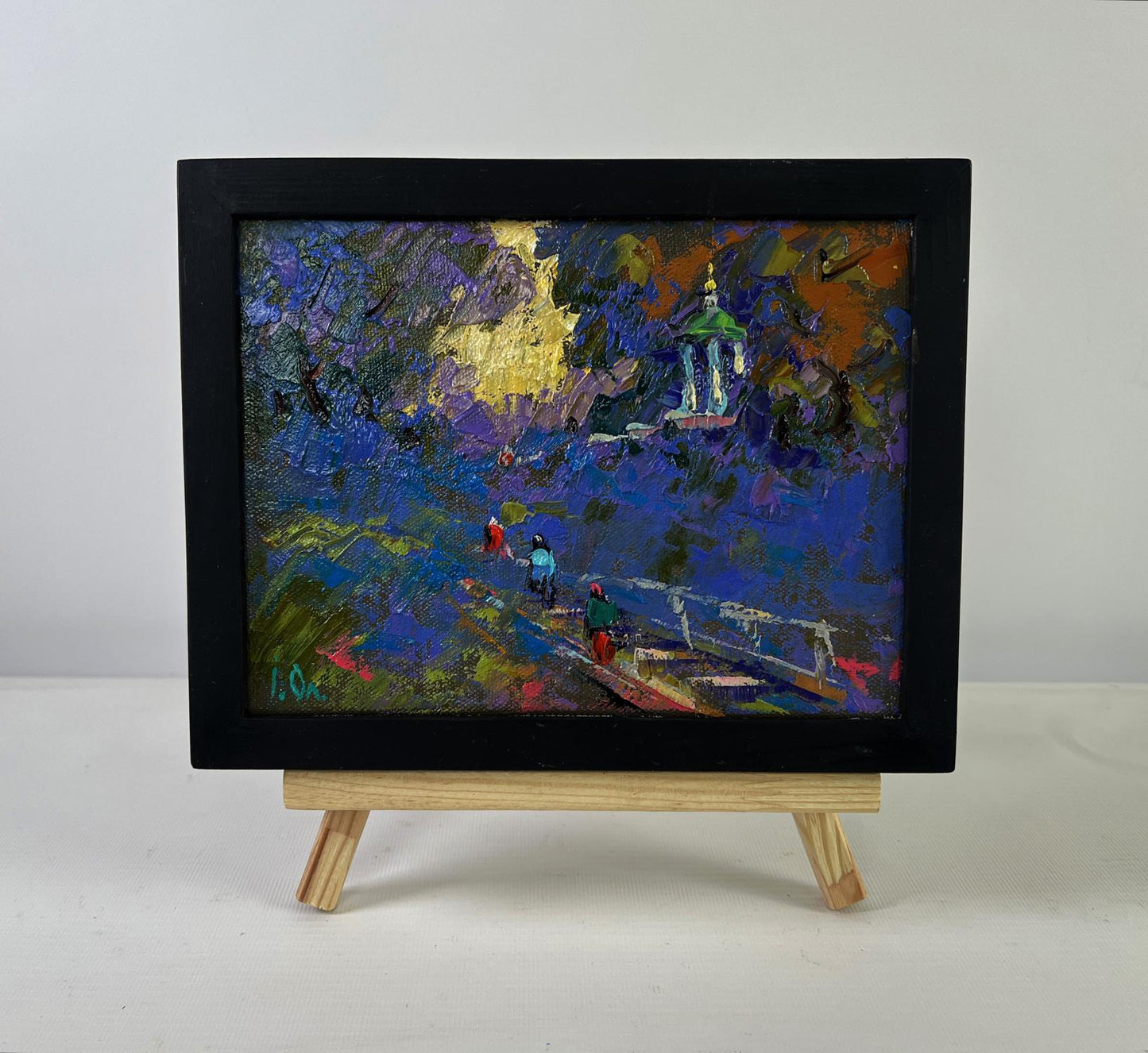 Oil painting Warm moments among loved ones by Oleksiy Ivanyuk in black frame