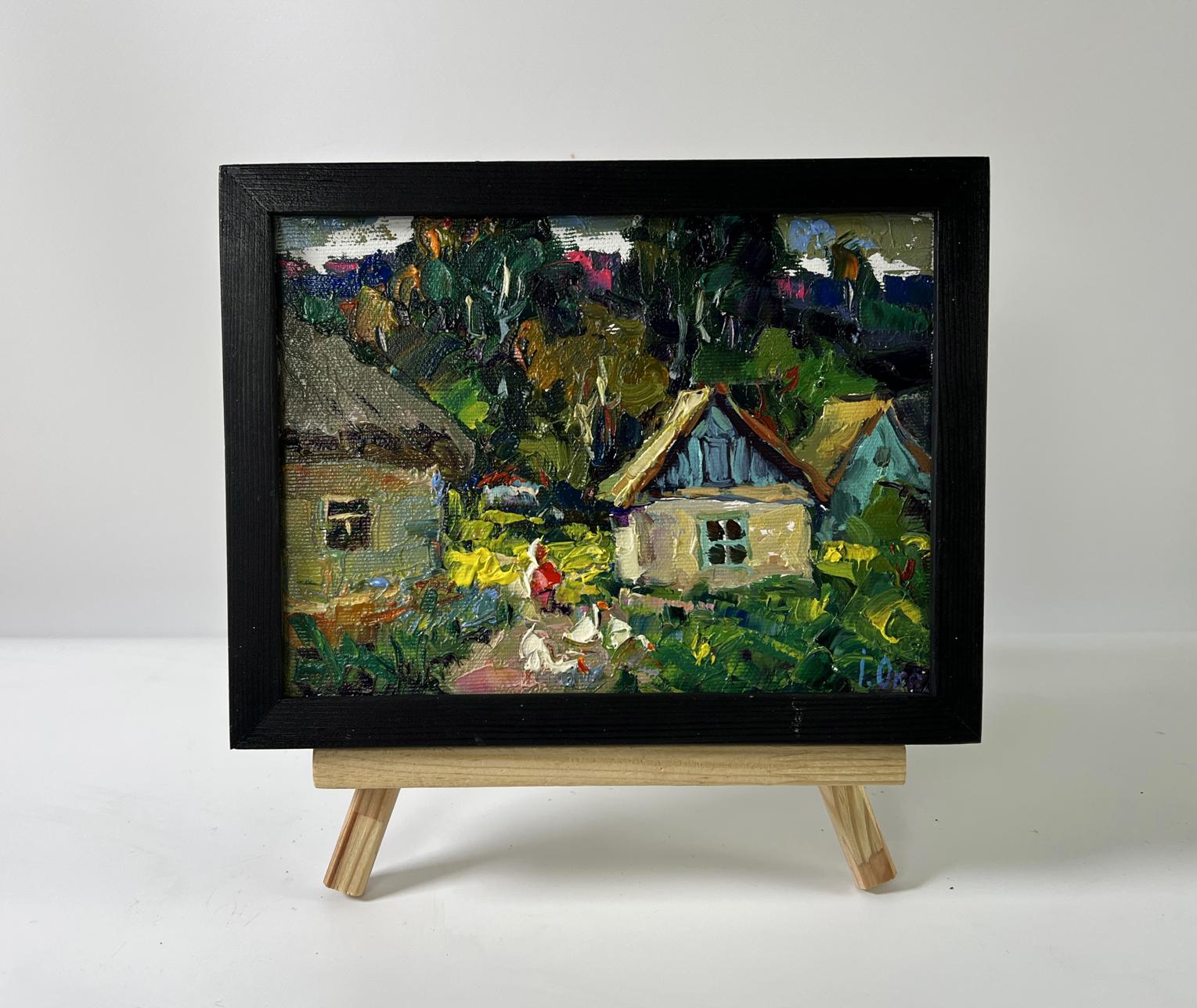 Oil painting of rural village by Oksana Ivanyuk in black frame