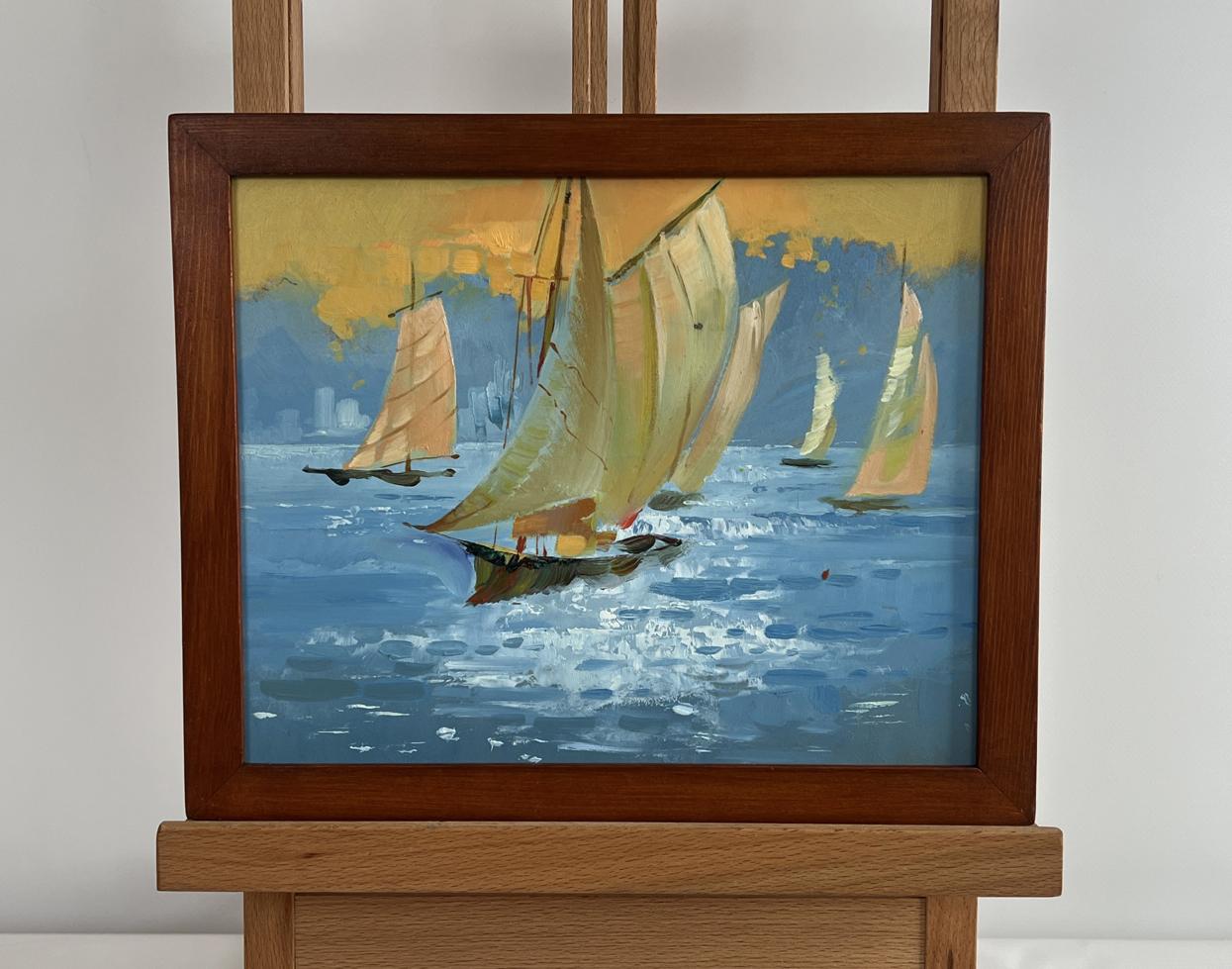 Oil painting of sailboats on blue sea under yellow sunset sky by Yuriy Suprunchuk