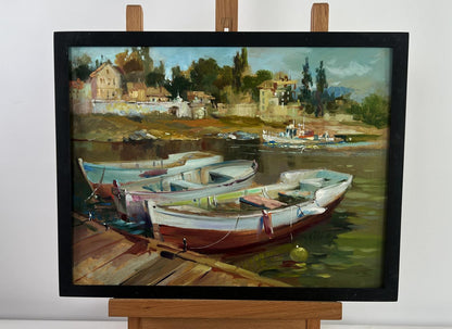 Framed oil painting of city boats at dock by Yuriy Suprunchuk