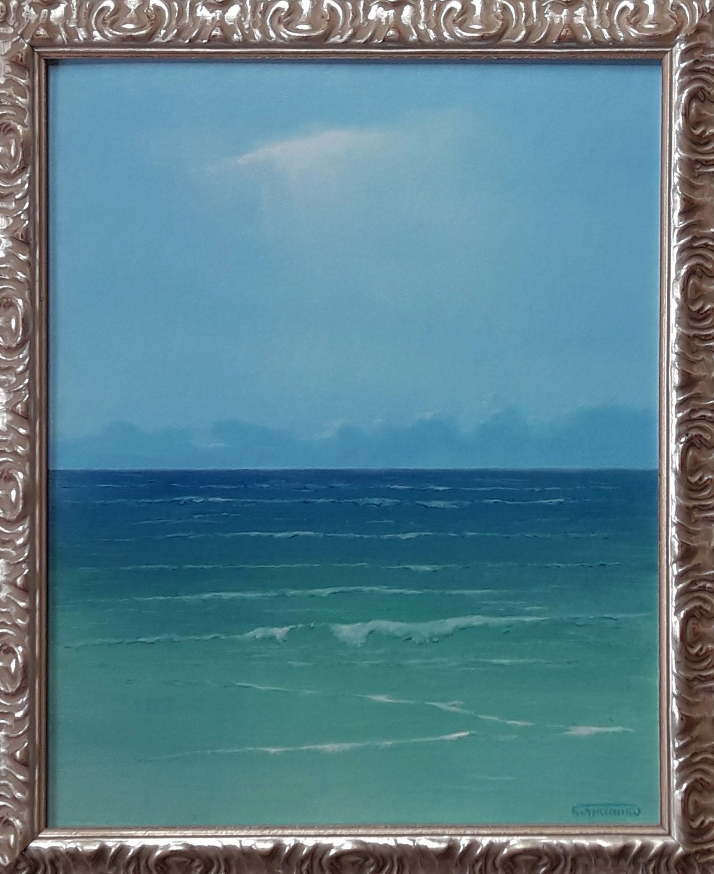 Silver ornate frame with Vasily Korkishko oil painting of serene turquoise sea reflecting sky
